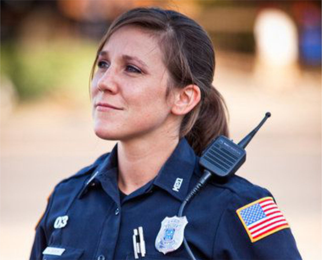 Woman Police officer in uniform looking confident signifying security at Fairview Apartments St Peter MN